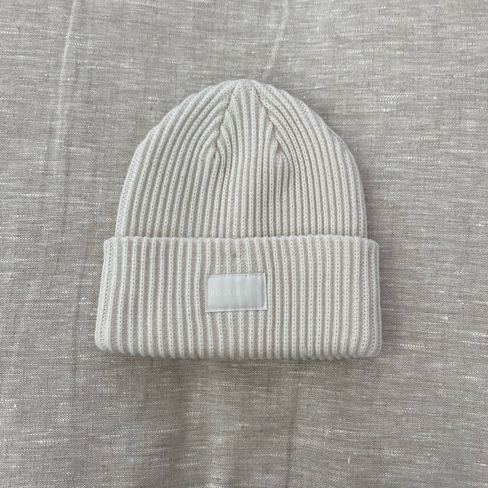 Cream and black beanies
